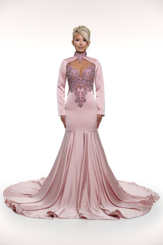 Pink evening gown with intricate detailing on a white background