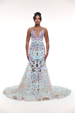 Woman wearing a detailed evening gown on a white background