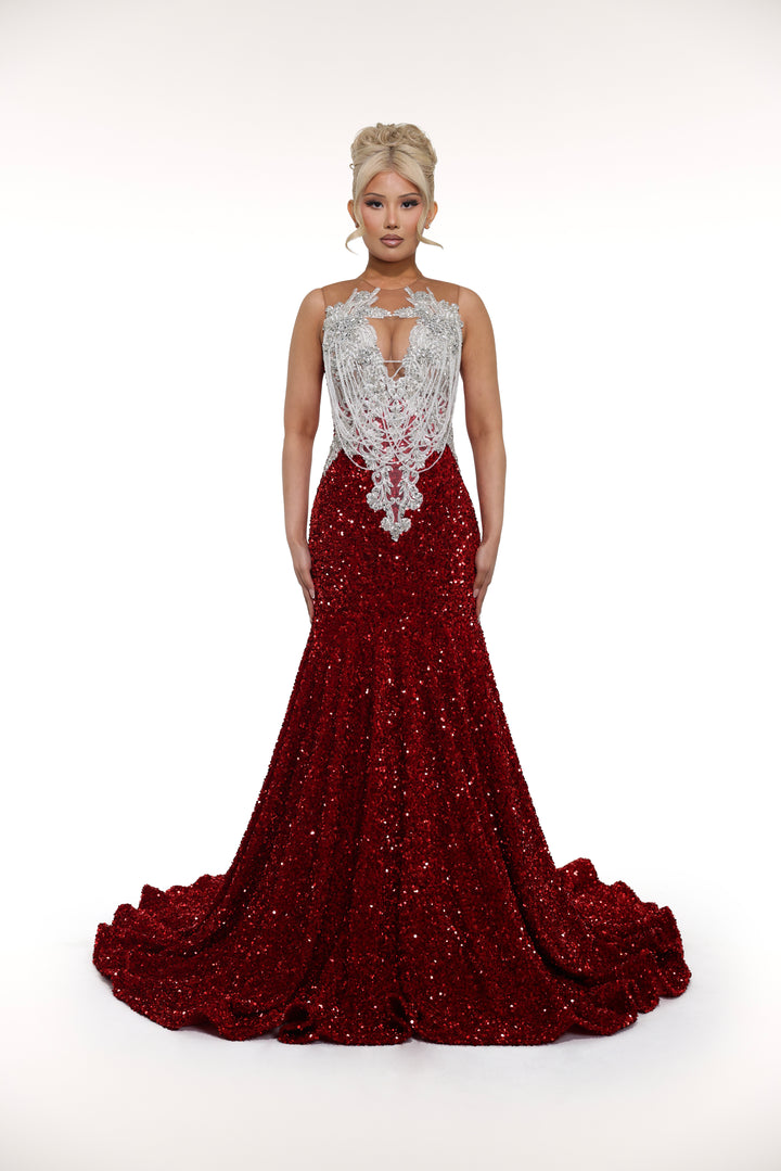 Red evening gown with silver embellishments on a white background